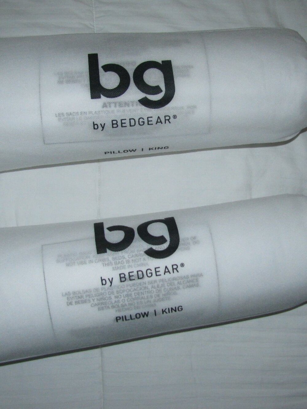 NEW - 2 KING SIZE PILLOWS WITH PILLOW PROTECTERS